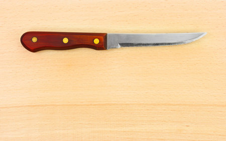 Knife and chopping board - food background