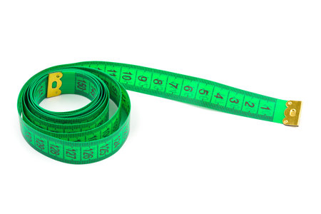 Green measuring tape isolated on white backgroundの写真素材