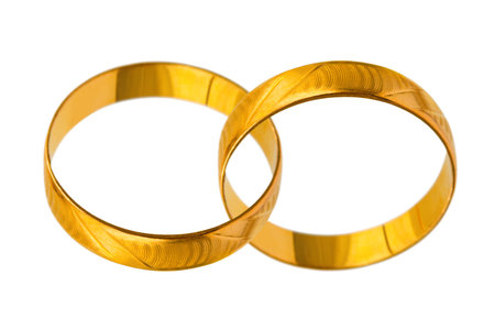 Connected wedding rings isolated on white backgroundの写真素材