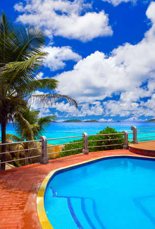 Pool in hotel at tropical beach - vacation backgroundのeditorial素材