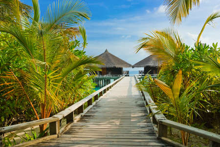 Water bungalows on a tropical island - travel backgroundのeditorial素材