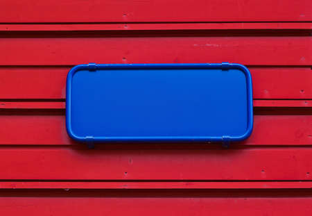 Blank blue plate on red - abstract backgroundの写真素材