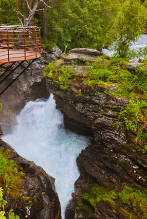 Waterfall near Geiranger fjord Norway - nature and travel backgroundの写真素材