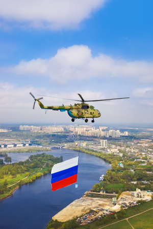 Helicopter with russian flag over Moscow at parade of victory day - aerial viewの写真素材