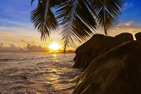 Sunset on tropical beach Source D'Argent at Seychelles - nature backgroundの写真素材