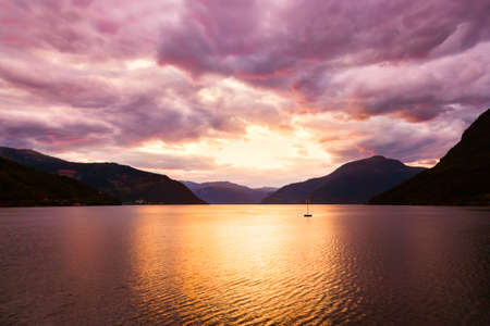 Sunset in fjord Hardanger Norway - nature and travel backgroundの写真素材