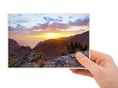 Tenerife Canary photography in hand (my photo) isolated on white backgroundの写真素材