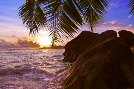 Sunset on tropical beach Source D'Argent at Seychelles - nature backgroundの写真素材