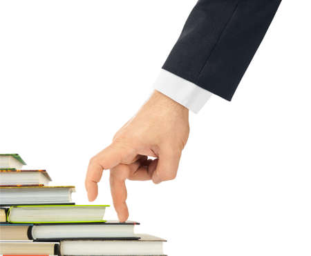 Hand and book stairs isolated on white backgroundの写真素材