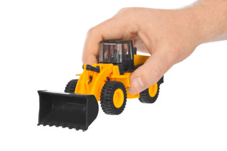 Hand with toy loader isolated on white background