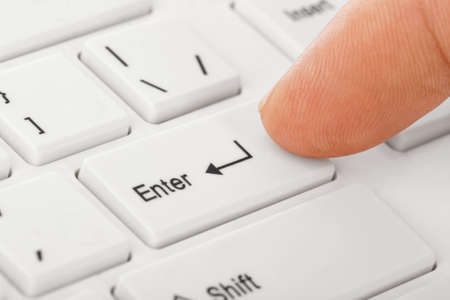 White computer keyboard and hand - technology background