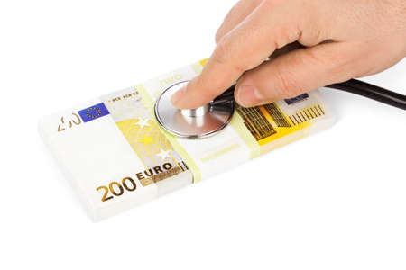 Hand with stethoscope and money isolated on white background