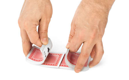 Hand and playing cards isolated on white background