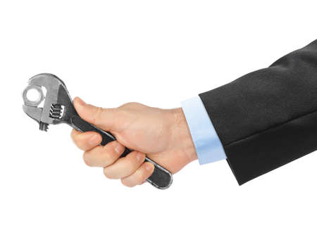 Adjustable spanner in hand isolated on white backgroundの写真素材