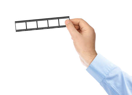 Photographic film in hands isolated on white backgroundの写真素材