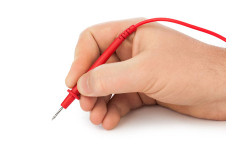 Hand and electric multimeter isolated on white background