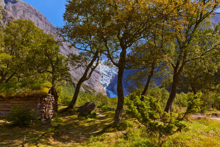 Old house near Briksdal glacier - nature and travel backgroundの写真素材