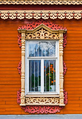 Carved window of old wooden house in historical town Kolomna - Russiaの写真素材