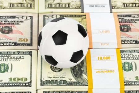 Money and soccer ball - sport and business backgroundの写真素材