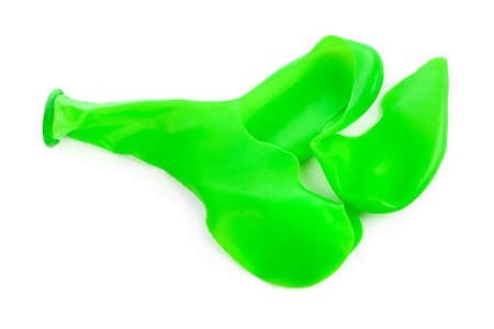 Popped air balloon isolated on white backgroundの写真素材