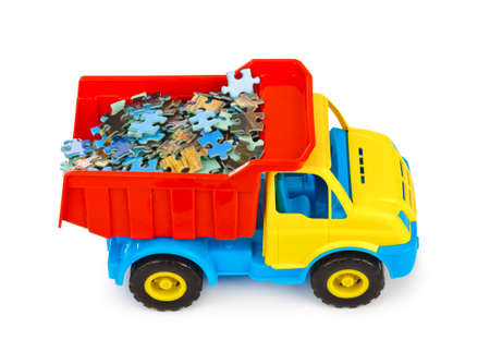 Toy truck with puzzle isolated on white backgroundの写真素材