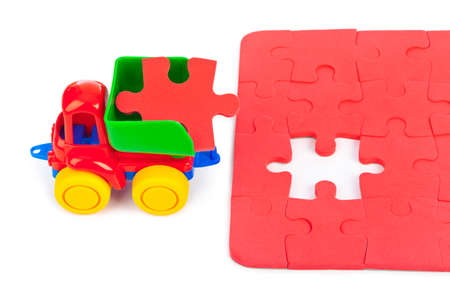 Toy truck with puzzle isolated on white backgroundの写真素材