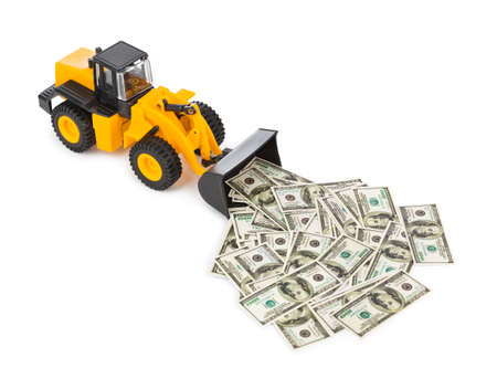 Toy loader and money isolated on white backgroundの写真素材