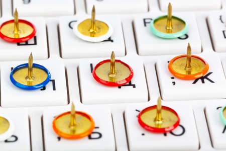 Pins on computer keyboard - concept backgroundの写真素材