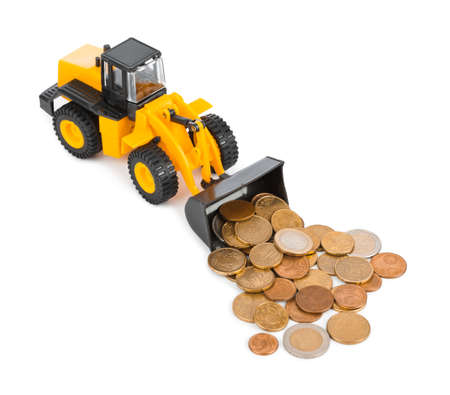 Toy loader and money coins isolated on white background