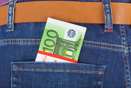 Money in jeans pocket - shopping background