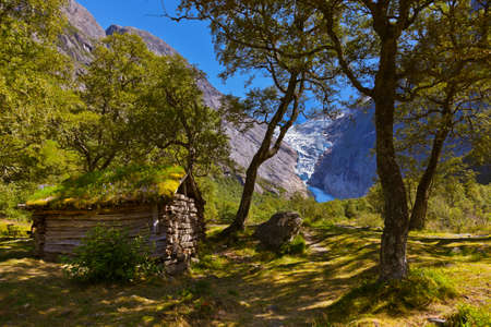 Old house near Briksdal glacier - nature and travel backgroundのeditorial素材