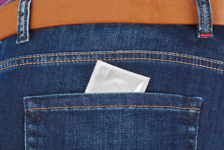 Condom in jeans pocket - health backgroundの写真素材