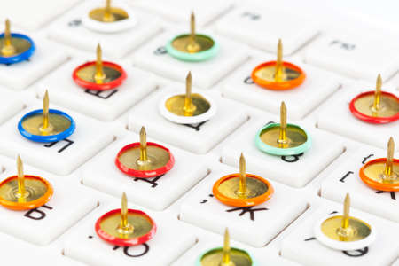 Pins on computer keyboard - concept background