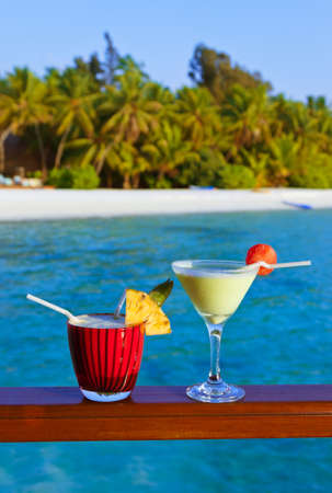 Fruit cocktail on Maldives beach - travel background