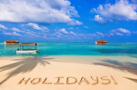Word Holidays on beach - nature holiday backgroundのeditorial素材