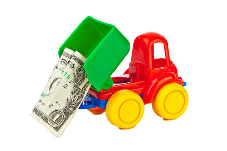 Toy car truck with money isolated on white backgroundの写真素材