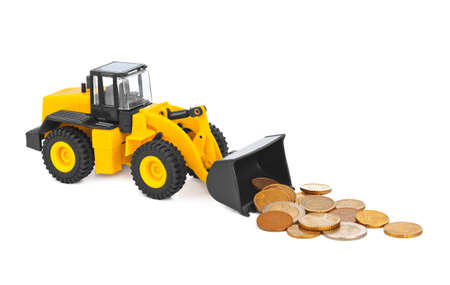 Toy loader and money coins isolated on white backgroundの写真素材