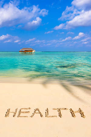 Word Health on beach - concept holiday backgroundの写真素材