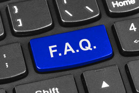 Computer notebook keyboard with FAQ key - technology backgroundの写真素材