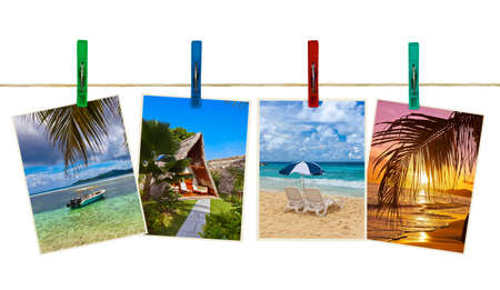 Vacation beach photography on clothespins isolated on white backgroundの写真素材