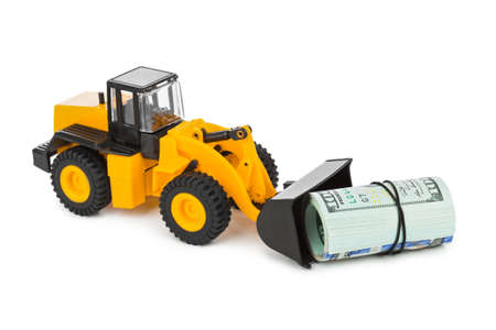 Toy loader and money isolated on white backgroundの写真素材