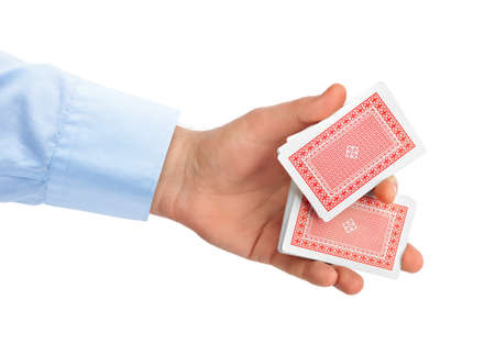 Hand and playing cards isolated on white background