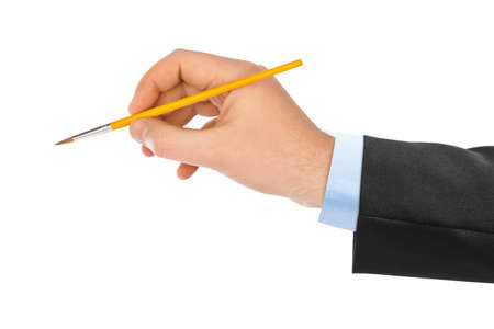 Hand with paintbrush isolated on white backgroundの写真素材