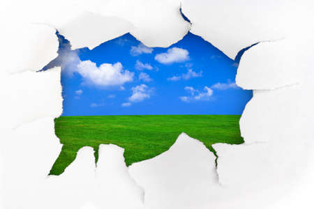 Paper hole and summer landscape - freedom conceptの写真素材