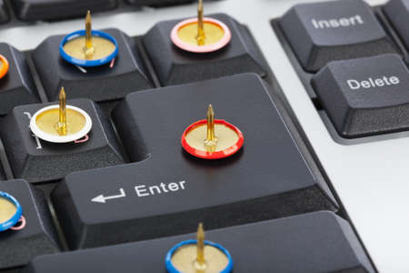 Pins on computer keyboardの写真素材
