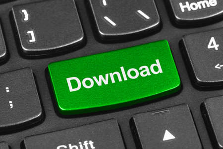 Computer notebook keyboard with Download key - technology background