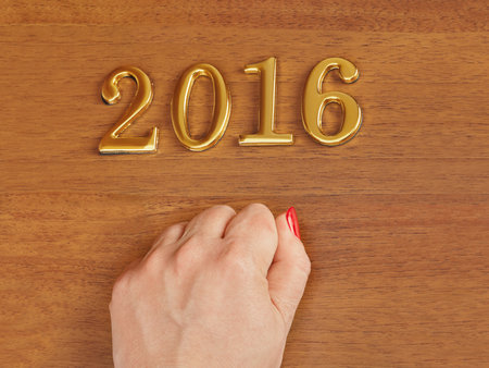 Hand and numbers 2016 on door - new year concept backgroundの写真素材