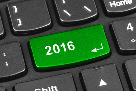 Computer notebook keyboard with 2016 key - holiday technology conceptの写真素材