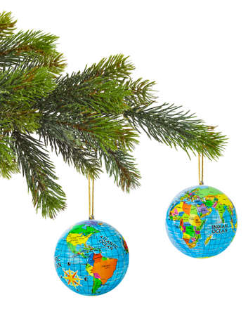 Globe and christmas tree isolated on white backgroundの写真素材