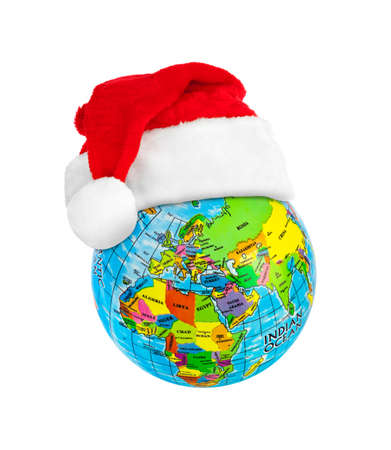 Globe and Santa Claus red christmas hat isolated on white backgroundの写真素材